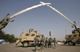 US soldiers under a Saddam-era monument in Baghdad(Photo: Reuters)