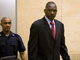 Thomas Lubanga (R) enters court at the beginning of his trial a(Photo: ICC handout)