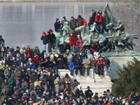 People gather on a statue next to the National Mall.(Photo: Reuters)