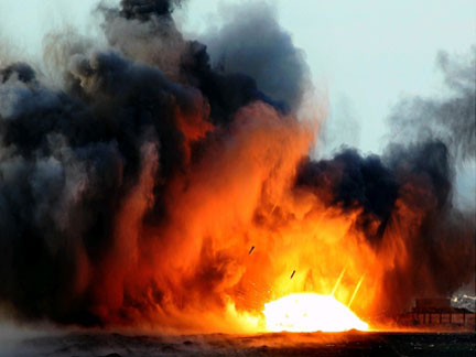 Bombs fall as an explosion is seen after an Israeli air strike in the northern Gaza Strip on Thursday 
(Photo: Reuters)