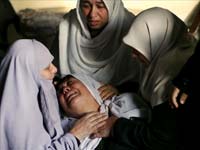 Palestinian women react after their relative Billal Nabham was found dead underneath the rubble in Gaza(Credit: Reuters)