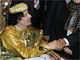 Muammar Gaddafi shakes hands with delegates at the AU summit(Photo: Reuters)