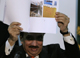 Rehman Malik shows pictures of trawlers used by the perpetrators of the Mumbai attacks(Photo: Reuters)