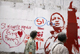 Women walk past a mural promoting the option of &quot;Si&quot; (yes) ahead of Sunday's Referendum in Caracas(Photo: Reuters)