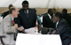 Mugabe (R) listens to MDC Senator David Coltart(Photo: Reuters)