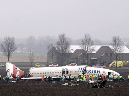 Emergency workers on the scene of the crash(Photo: Reuters)
