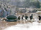 Rescuers search for flood victims on the outskirts of Jakarta 27 March 2009. (Photo: Reuters)