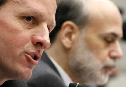 Geithner gives his opening statement as Federal Reserve Chairman Ben Bernanke (R) listens(Photo: Reuters)
