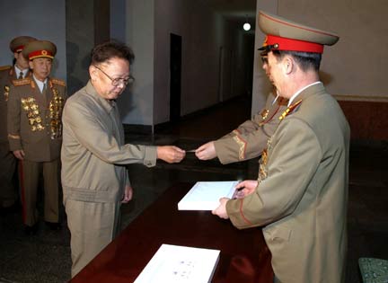  Kim Jong-il (L) takes part in assembly elections