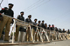Police stand behind a barricade in Multan(Photo: Reuters)