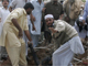 Tribesmen pull a body from the mosque's debris(Photo: Reuters)