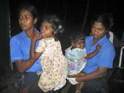 Navy medical personnel carry injured Tamil girls in Trincomalee(Photo: Reuters)