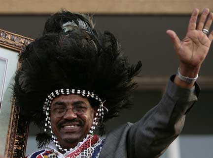 Beshir in traditional southern headdress in Khartoum Saturday(Photo: Reuters)