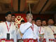 Outgoing youth wing chief of the Malaysia's United Malays National Organisation, Hishammuddin Hussein (C), kisses a 'keris', a Malay dagger which is a symbol of the party, during its annual assembly in Kuala Lumpur March 25, 2009. (photo: Reuters)