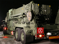 A truck carrying PAC-3 missiles arrives in Asaka, near Tokyo, on 27 March.(Photo: Reuters)