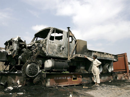 A burnt NATO supply truck outside of Peshawar(Photo: Reuters)