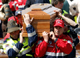 The coffin of a victim is carried at the service(Photo: Reuters)