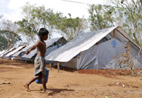 A boy carries water in a displaced persons camp in Jaffna.(Photo: AFP)