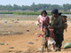 A Sri Lankan soldier pushes a woman fleeing a rebel-controlled area, in Puthukkudiyirippu, northern Sri Lanka, 22 April 2009(Photo: Reuters)