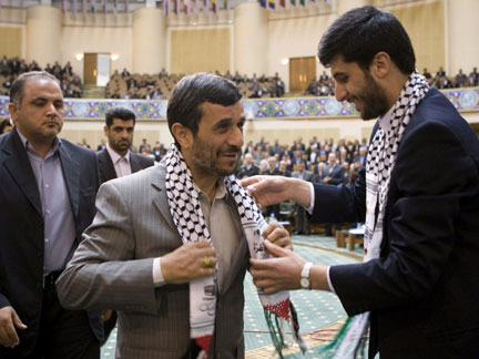 Iran's President Mahmoud Ahmadinejad receives a Palestinian scarf during the International Conference of the Prosecutors of Islamic Countries last week(Photo: Reuters)
