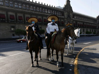 Mexican mounted policemen patrol Mexico City's historic Zocalo square on Saturday 
(Photo: Reuters)