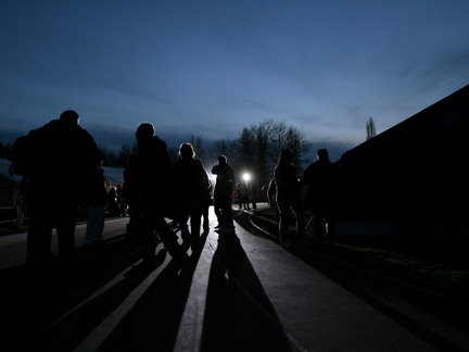 People stand in a tent camp where earthquake victims reside in Aquila. (Photo: Reuters)