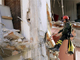 A firefighter working on a destoyed building in L'Aquila on 7 April(Photo: Reuters)