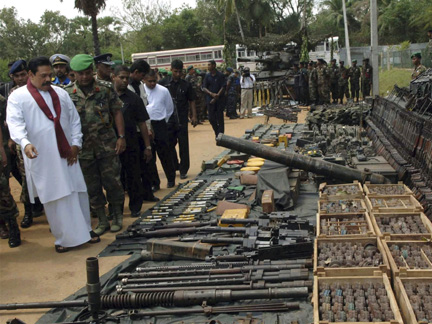 Sri Lankan President Mahinda Rajapaksa inspects weapons, on Thursday, which the army claim to have captured from the LTTE(Photo: Reuters)