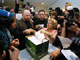 Reporters crowd around a clerk (C) to receive copies of the landmark verdict in the Pirate Bay file-sharing trial in Stockholm on 17 April 2009.(Photo: Reuters)