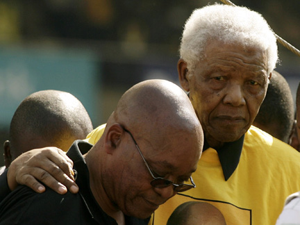 Nelson Mandela (R) is helped off the stage by ANC president Jacob Zuma on Sunday
(Photo: Reuters)