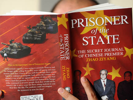 A man reads a copy of Zhao Ziyang's memoirs in Hong Kong.(Photo: AFP)