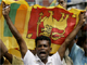 A man celebrates the Sri Lankan government's victory over the Tamil Tigers in Colombo, 17 May 2009(Photo: Reuters)