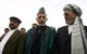 Afghan President Hamid Karzai (C) stands between his running mates, former vice president Mohammad Qasim Fahim (L) and current vice president Karim Khalili, in Kabul
Photo: REUTERS/Ahmad Masood 
