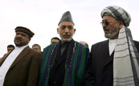 Afghan President Hamid Karzai (C) stands between his running mates, former vice president Mohammad Qasim Fahim (L) and current vice president Karim Khalili. Photo: REUTERS/Ahmad Masood 