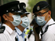 Police outside the Hong Kong hotel where guests and staff have been ordered to stay after a case of H1N1(Photo: Reuters)