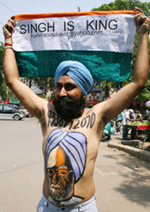 A fellow Sikh celebrates Singh's return to the premiership(Photo: Reuters)