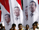 Indonesians with banners of Vice-President Jusuf Kalla and People's Conscience Party leader Wiranto after they registered as presidential and vice-presidential candidates(Photo: Reuters)