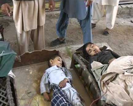 TV footage shows the bodies of two dead children at a makeshift hospital in the town of Mingora, located in the Swat district(Photo: Reuters)