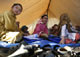 Internally displaced children in Swabi district, hold classes inside a tent at an UNHCR camp, 11 May 2009.photo: REUTER Mian Khursheed 