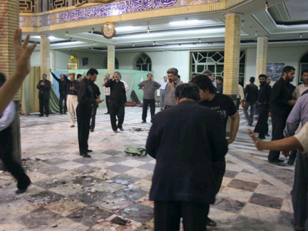 Iranians officials search inside the mosque after Thursday's bomb explosion in Zahedan, 1076 km  south east of Tehran(Photo: Reuters)