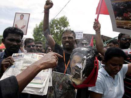 An ethnic Tamil Malaysian holds an effigy of Sri Lanka's President Rajapakse during a demonstration outside the Sri Lankan embassy in Kuala Lumpur on Friday(Photo: Reuters)