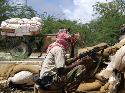 An Islamist fighter guarding a checkpoint in southern Mogadishu on 20 May(Photo: Reuters)