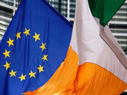 An Irish flag flies next to an EU flag in front of the EU Commission headquarters in Brussels (Photo: Reuters)