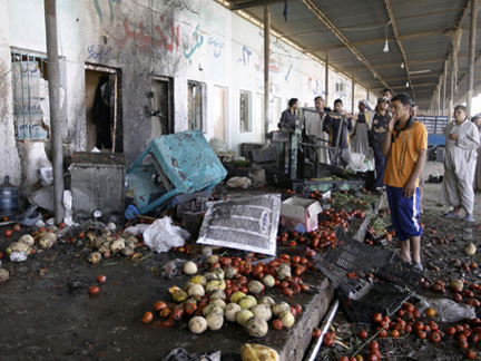 The aftermath of a vegetable market blast in Baghdad, where bombings are common. Today's attack, in the southern town of Batha, was the bloodiest in weeks.Photo: Reuters
