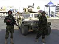 Soldiers from the Afghan National Army keep watch in Kandahar city, 29 June 2009.(Photo: Reuters)