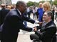 Mozambiquan Foreign Minister Oldemiro Baloi greets a Serbian cluster bomb victim at the conference(Credit: Reuters)