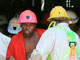 South African miners surface after 36 hours trapped in a mine in Carletonville, October 2007(Photo : Reuters)