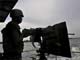 A Nigerian Joint Task Force soldier mans a weapon in the Niger Delta(Credit: Reuters)