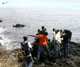 Cameramen and residents stand at the Indian Ocean beach as rescuers search for the missing Yemenia A310-300 airplane(Photo: Reuters)