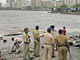 Police stand guard at the shores of Arabian Sea in Mumbai (Photo: Reuters)